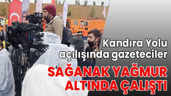 Kandıra Yolu açılışında gazeteciler sağanak yağmur altında çalıştı